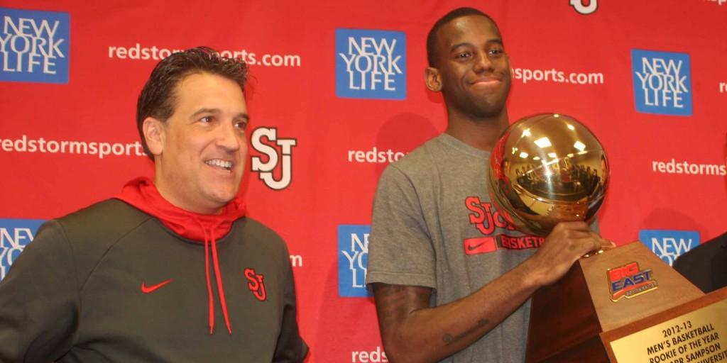 Steve Lavin and JaKarr Sampson pose with the Rookie of the Year trophy. 