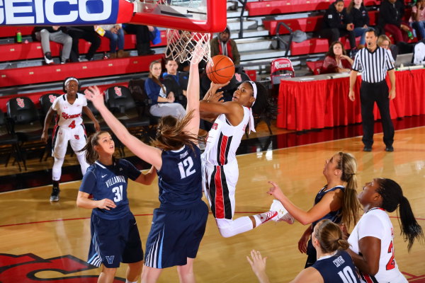 Aliyyah Handford (3) absorbs contact and attempts the layup in the Red Storms 71-59 loss to Villanova on Feb. 12, 2016. (Photo: St. Johns Athletic Communications)