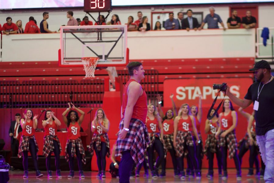 Matthew Kirschenheiter, freshman, does a dance routine on the basketball court for this year’s Tip-Off.