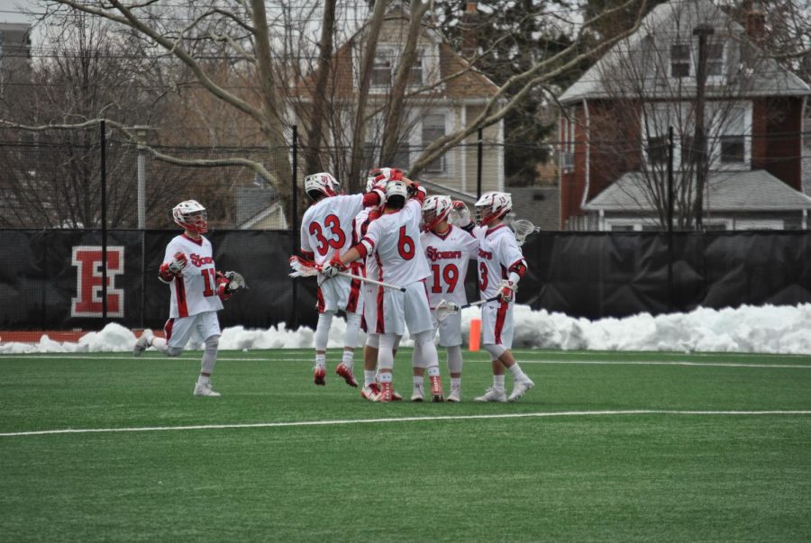 Joe Madsen (33) and Mike Madsen (11) celebrate a goal against Siena College.