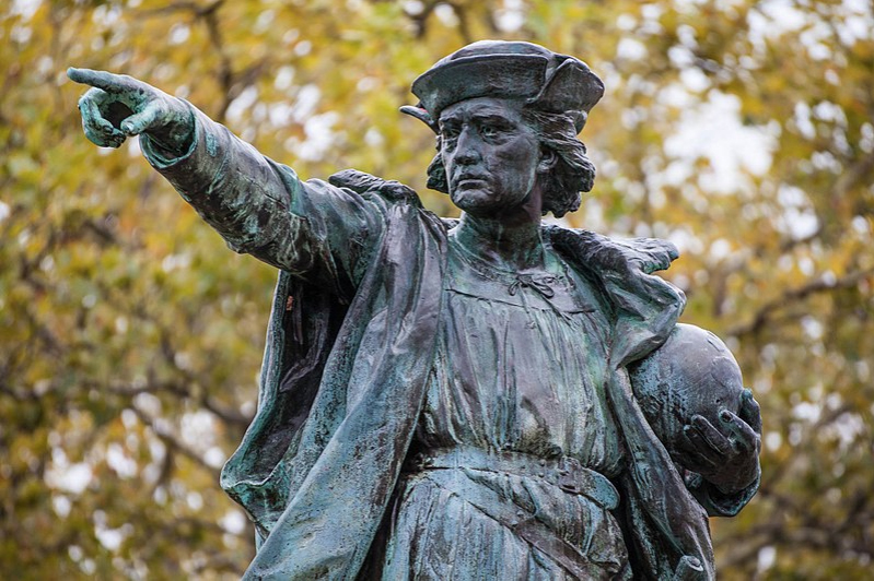  A statue of disgraced Christopher Columbus in a park.