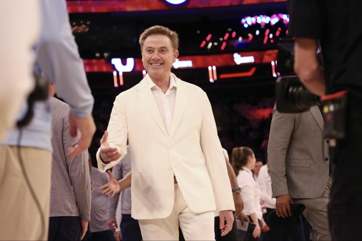 Rick Pitino celebrated Johnnies Day complete with a white Armani suit.
Torch Photo / Sara Kiernan