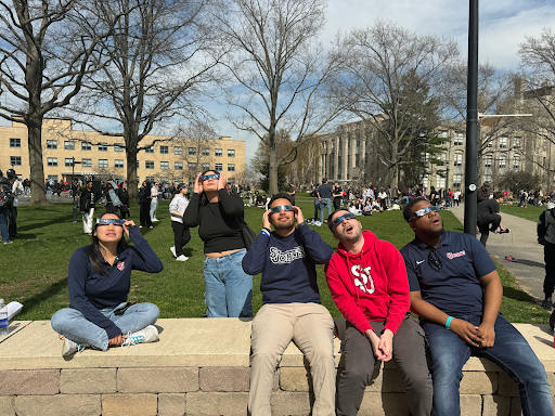 SJU students gathered on the Great Lawn to watch the solar eclipse. 
Torch Photo / Olivia Rainson