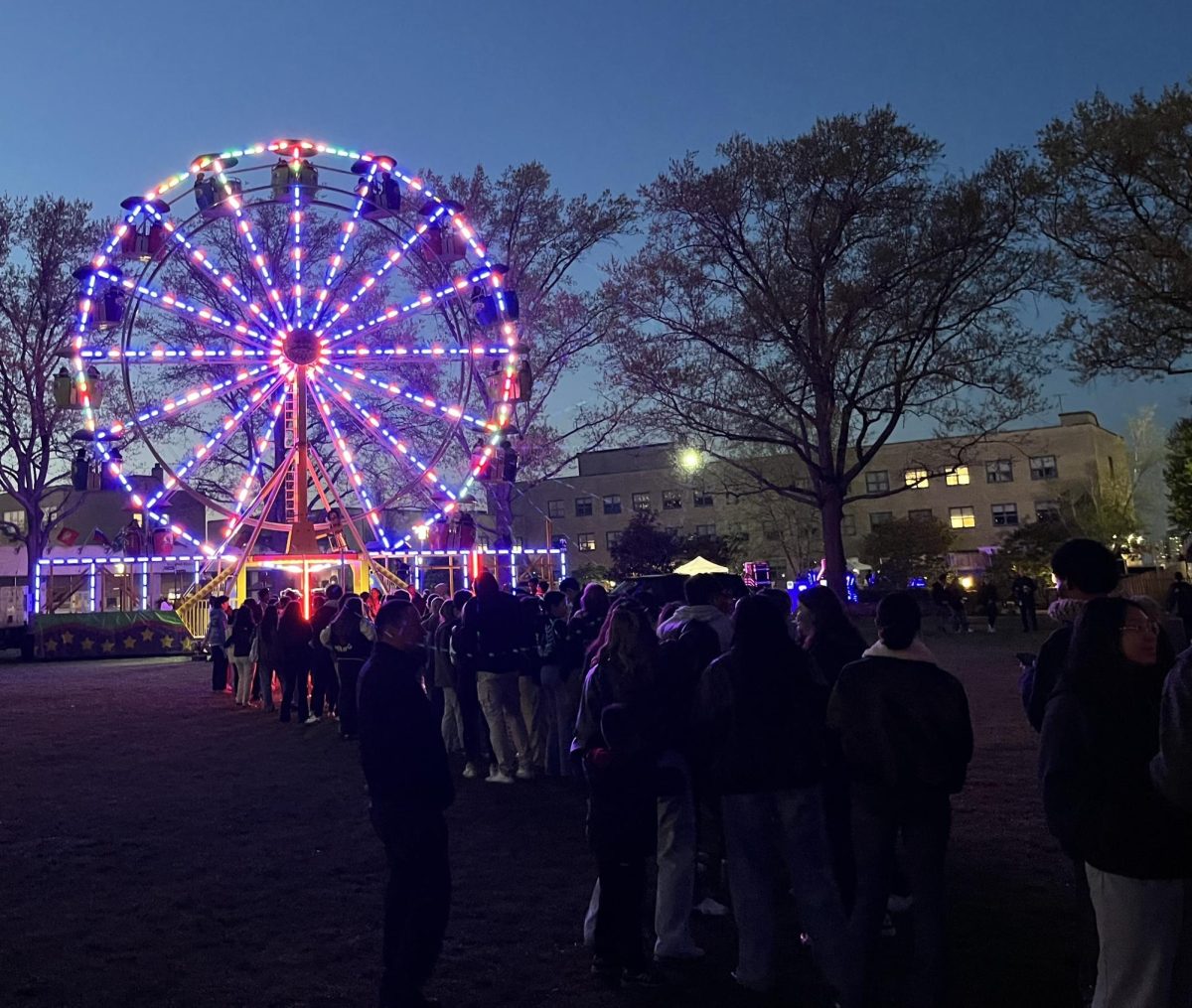 Students line up for the 75-foot Ferris Wheel. (Torch Photo / James Williams)
