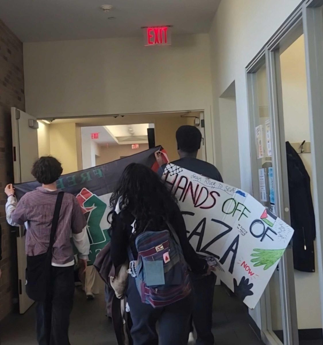 SJU students and faculty walked through campus and held signs in protest of the on-campus Starbucks and Burger King.
Torch Photo / Malak Kassem